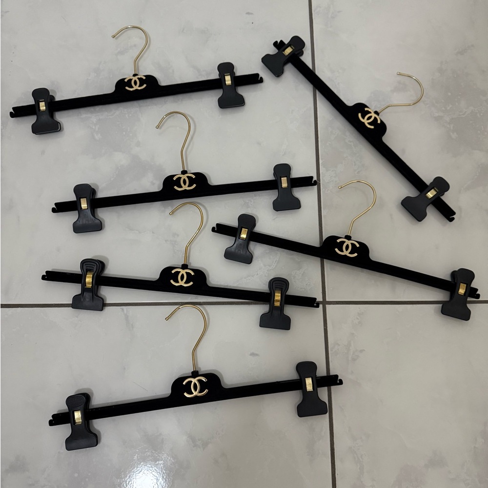 CHANEL Black and Gold Clip Hangers